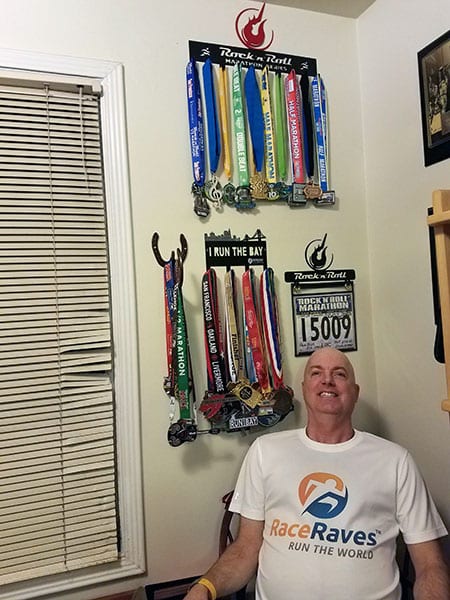 RaceRaves member Eric McClendon showcases his medal collection