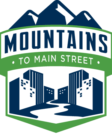 Mountains to Main Street Half Marathon & 5K logo on RaceRaves