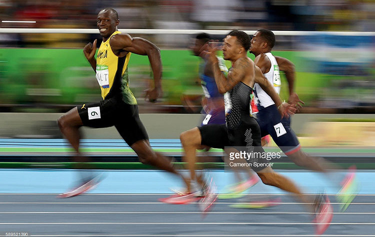 Usain Bolt smiling during a race