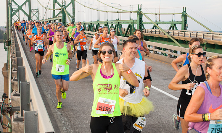 Quad Cities Marathon runners crossing the bridge from Illinois to Iowa