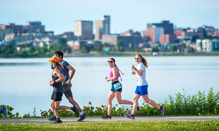 Runners circle the Back Cove at the Shipyard Old Port Half in Portland, Maine