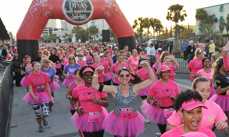 Runners wearing pink at the start line of the Divas Half Marathon & 5K in Chicago