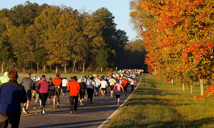 Runners pass colorful fall foliage at the Chickamauga Battlefield Races